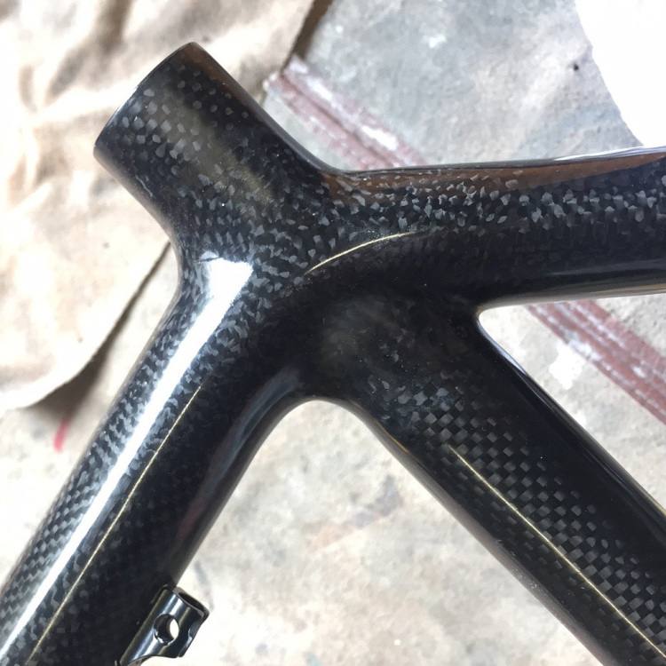 Fig now strengthened, All damaged carbon was cut out and new blended into the existing frame, this gives a continous flow to the repaired area. My customer requested a nude carbon finish rather than re-apply the existing paint scheme.